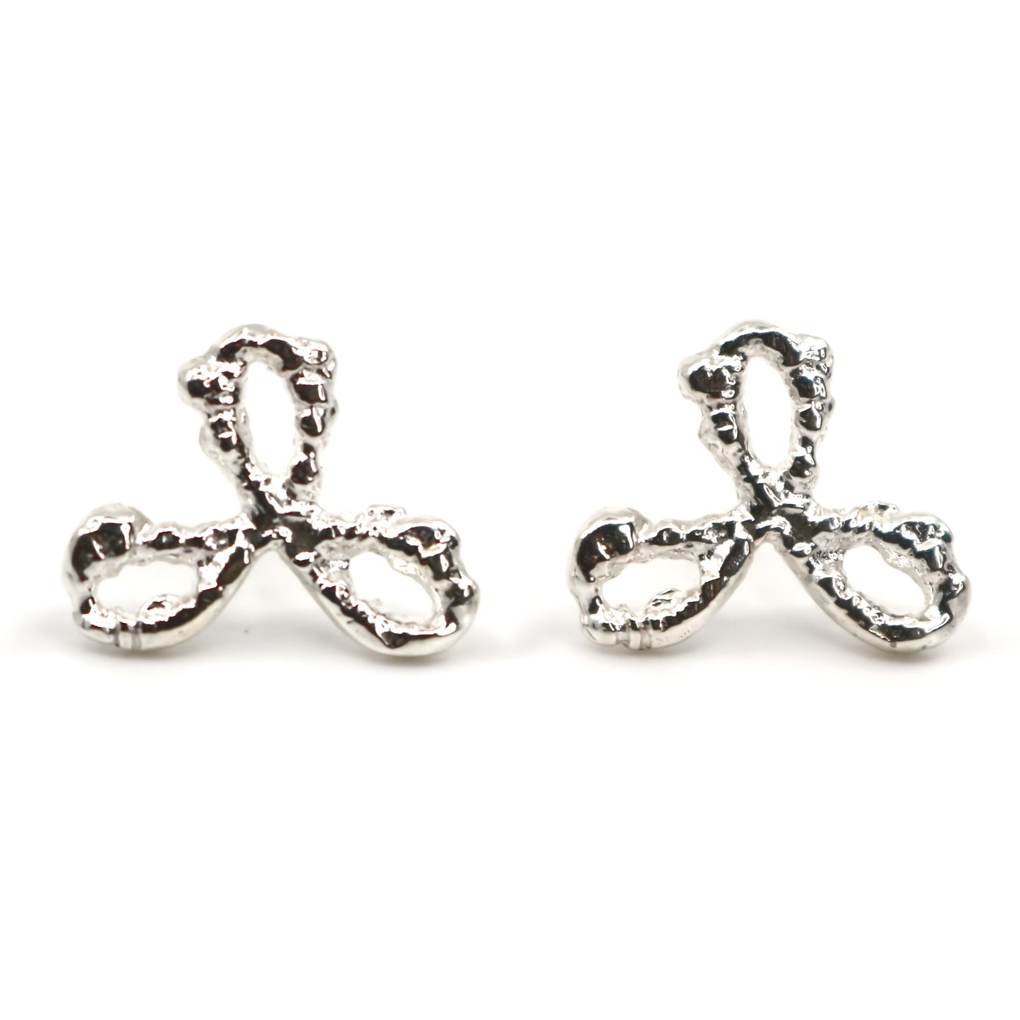 Pair of silver earrings on a white background