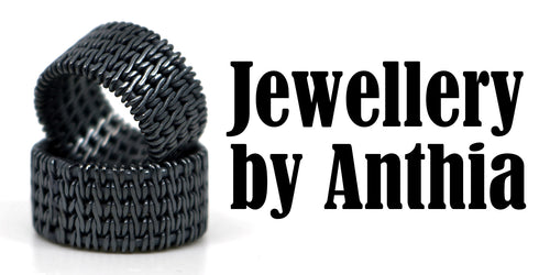 Black textured ring with 'Jewellery by Anthia' text on a white background