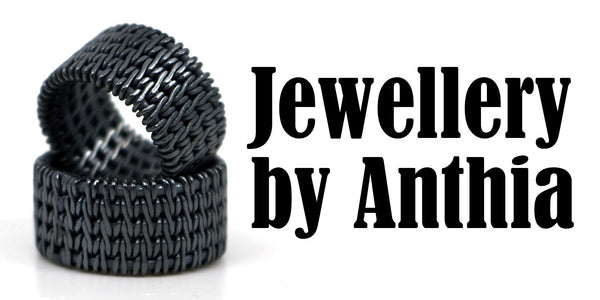 Black textured ring with 'Jewellery by Anthia' text on a white background