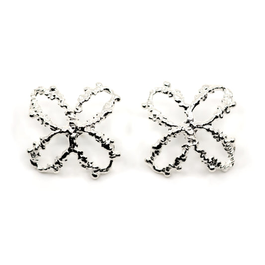 Pair of silver 4 petal flower earrings on a white background